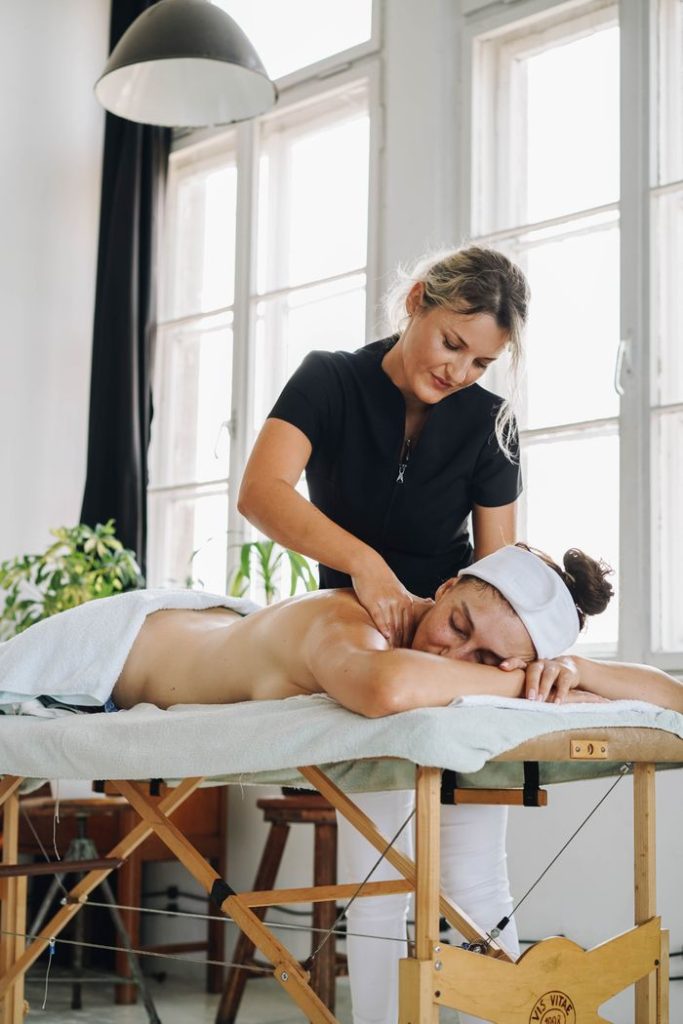 Relaxing massage session at a spa with a professional therapist indoors.
